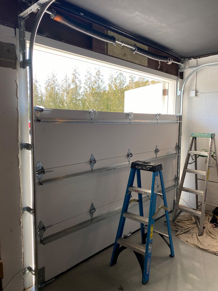 Insulated steel carriage-house style garage door installed.