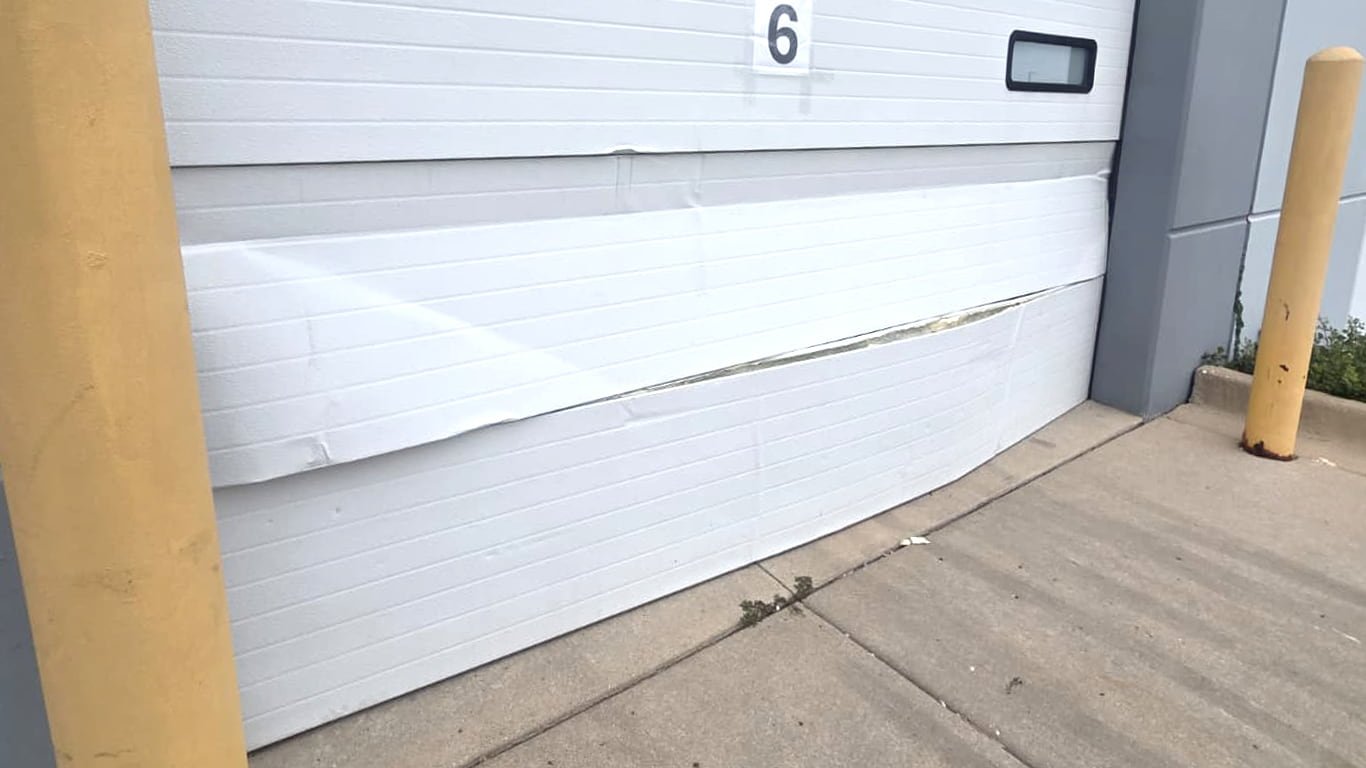 Garage door panel after storm damage.